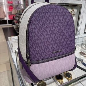 MICHAEL KORS Rhea Medium Zip Color-Block Signature Logo Backpack
Dark Purple MLT